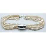 A four strand cultured pearl with large silver slider