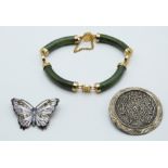 A silver brooch in the form of a butterfly set with enamel by J A & S, nephrite jade bracelet and