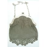A shaped white mesh /silver mesh purse/bag with trailing daisy-style decoration marked 'Alpaca',