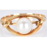 A yellow metal ring set with a pearl, 2.3g, size Q