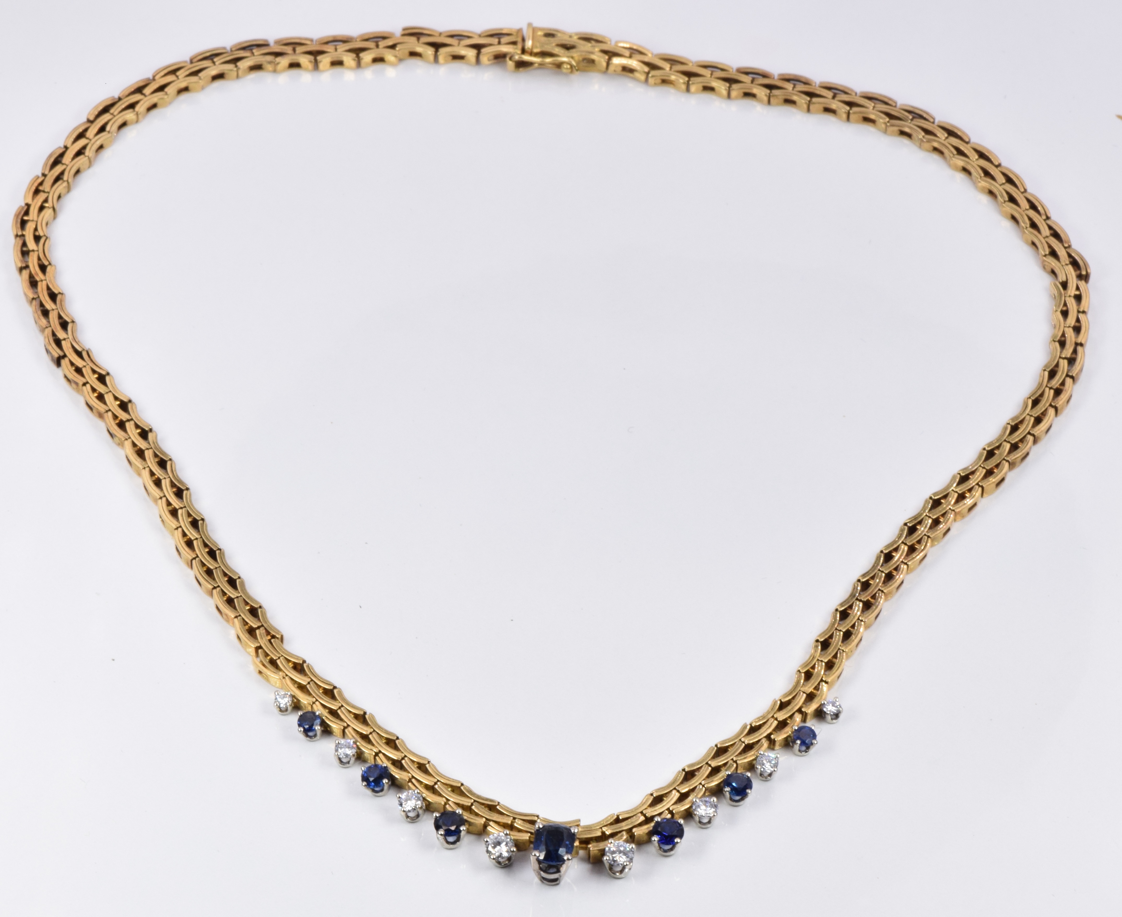 Gubelin 18ct gold necklace set with an oval cut sapphire of approximately 0.68ct, six round cut - Image 2 of 4