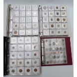 Four collector's albums containing a large collection of world coinage, mostly catalogued in