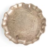 Carrington & Co. George V hallmarked silver card tray or small salver, with shaped edge and raised