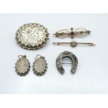 Victorian brooch and matching earrings with chased decoration, Victorian white metal brooch in the