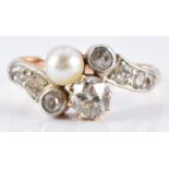 Victorian ring set with a pearl and old cut diamonds, the largest approximately 0.5ct, in a twist