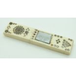 Georgian bone needle case with cut steel decoration and inset mirror, length 8cm