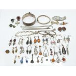 A collection of silver jewellery including silver bangle, silver rings, silver earrings etc, 213g