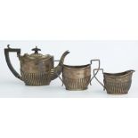 Edward VII hallmarked silver three piece bachelor's teaset with reeded lower body, Birmingham 1908