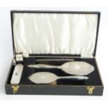 Broadway & Co hallmarked silver mounted dressing table set comprising hand mirror, two brushes and