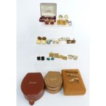 A collection of vintage cufflinks including two silver pairs