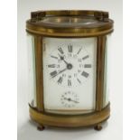Oval cased brass carriage clock with Roman and Arabic enamelled dial marked Deutsch, J Faubourg,