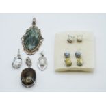 Four silver pendants set with dentric agate, howlite, seraflinte and pietersite and three pairs of