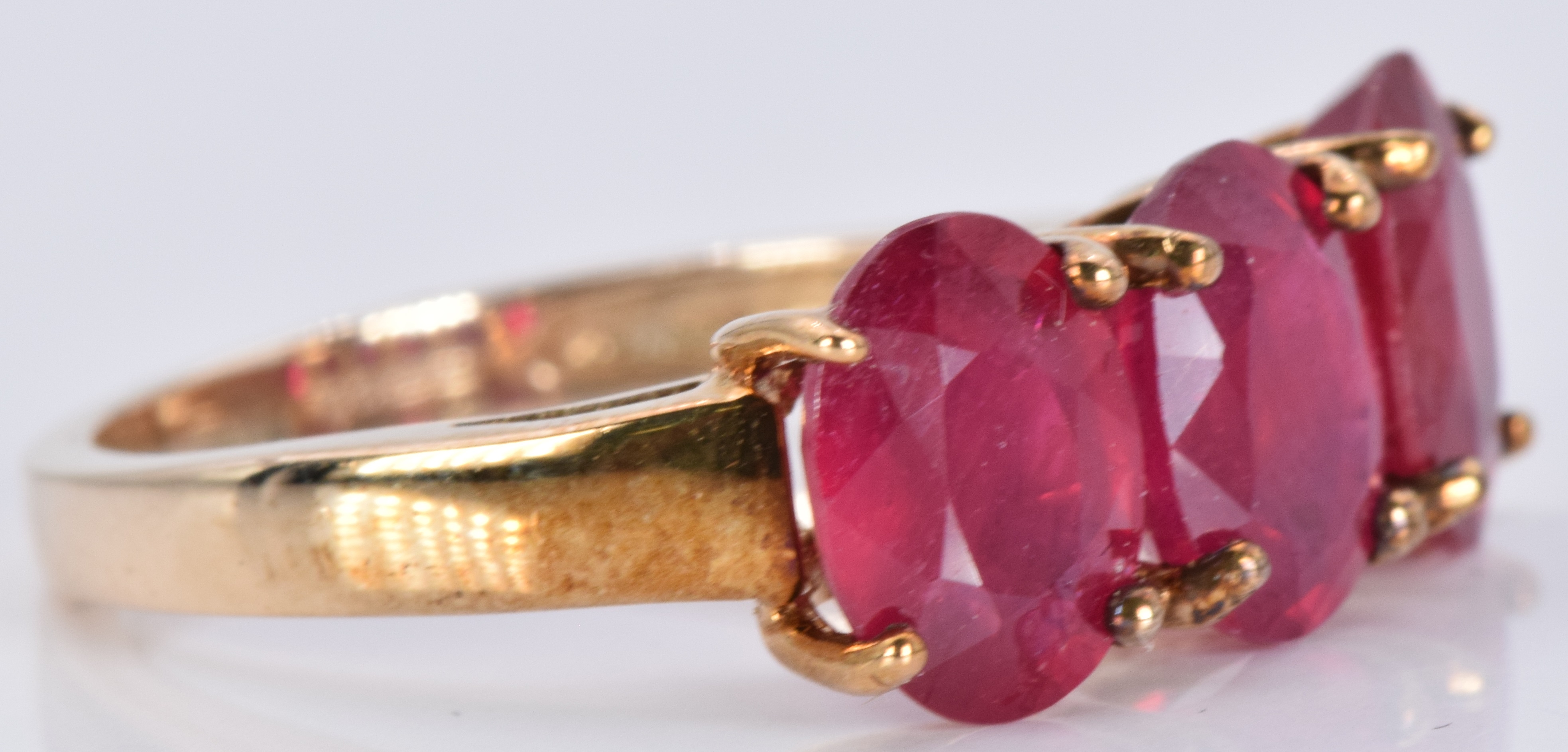 A 9ct gold ring set with three oval rubies, 3.7g, size J - Image 2 of 2