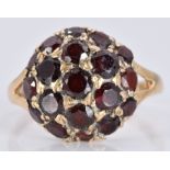 A 9ct gold ring set with garnets, 3.6g, size O