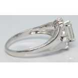 A 9ct white gold ring set with helidor and white topaz, 2.5g, size N