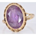 A 9ct gold ring set with an oval cut amethyst, 3.6g, size P