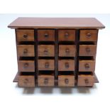 A hardwood miniature collector's chest of 16 drawers, W35 x D20 x H26cm