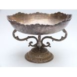 Large silver plated oval centrepiece bowl with hammered decoration raised on scrolling supports