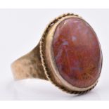 A yellow metal ring set with agate, size W