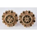 A pair of Victorian earrings set with a diamond to the centre, 1.5g