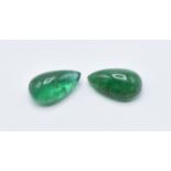 A pair of loose pear cut emeralds measuring 4.25ct each