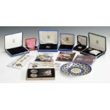 A collection of various silver proof and cupro-nickel commemorative coins, to include TT Winner