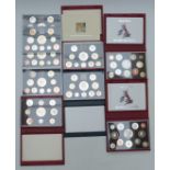 A collection of Royal Mail United Kingdom proof coins / coin sets including five Deluxe editions for