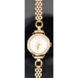 English 9ct gold ladies wristwatch with blued Breguet hands, gold stylised flower dial, silver