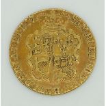 1795 George III gold guinea, toned with some patina / iridescence, GF/NVF