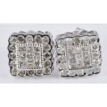 A pair of 9ct white gold earrings set with square cut and round cut diamonds