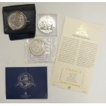 2016 silver 1oz Britannia, 2010 Chinese silver panda and an 1879 silver Morgan US dollar, all with