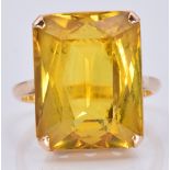 A yellow metal ring set with a mixed emerald cut citrine, 7.7g, size L