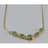 A 9ct gold necklace set with emeralds and diamonds, 4.2g