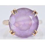 A 9ct gold ring set with a round cut amethyst, 4.7g, size O