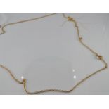 A 9ct gold chain and pendant set with a diamond, 2g