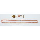 A beaded coral necklace and matching earrings with 9ct gold fittings, a pair of 9ct gold shell