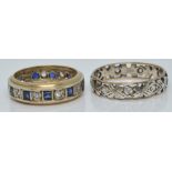 A 9ct gold eternity ring and another eternity ring, both set with paste, 6.1g, size P and K