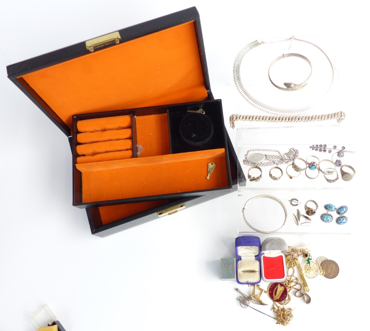 A collection of costume jewellery including four silver rings, vintage ring box, 9ct gold clip,