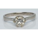 A 18ct gold ring set with a round cut diamond of approximately 0.55ct in a platinum setting, 2.6g,