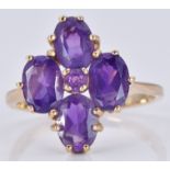 A 9ct gold ring set with five amethysts in a cluster, 3.3g, size O