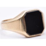 A 9ct gold signet ring set with onyx, 6.4g, size Q/R