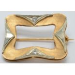 An 18ct gold bi-coloured brooch set with two cubic zirconia, 2 x 2.5cm, 6.2g