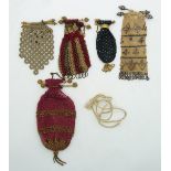 Five 19thC cut steel and embroidery purses with ornate bar clasps, longest 13cm