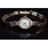 Rotary 9ct gold ladies wristwatch with gold hands and hour markers, silver dial and 21 jewel