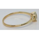 A 10k gold ring set with a heart cut csarite, with certificate, size U