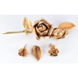 Yellow metal brooch in the form of a rose (16.5g) and similar 9ct gold earrings (2.8g)