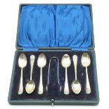 Cased set of six hallmarked silver shell topped pattern spoons and nips, Sheffield 1918 maker