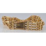 Edwardian 15ct gold bracelet, with links made up of four reeded bars interspersed with spheres, 23.