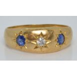 Edwardian 18ct gold ring set with a diamond and two sapphires in star settings, Chester 1909, 3.