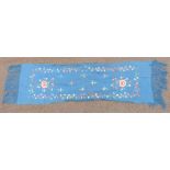 A 19th/20thC Chinese blue scarf with embroidered floral decoration and fringes, 180 x 45cm including